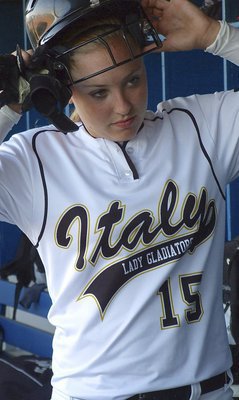 Image: Italy’s Jaclynn Lewis(15) makes an equipment change.