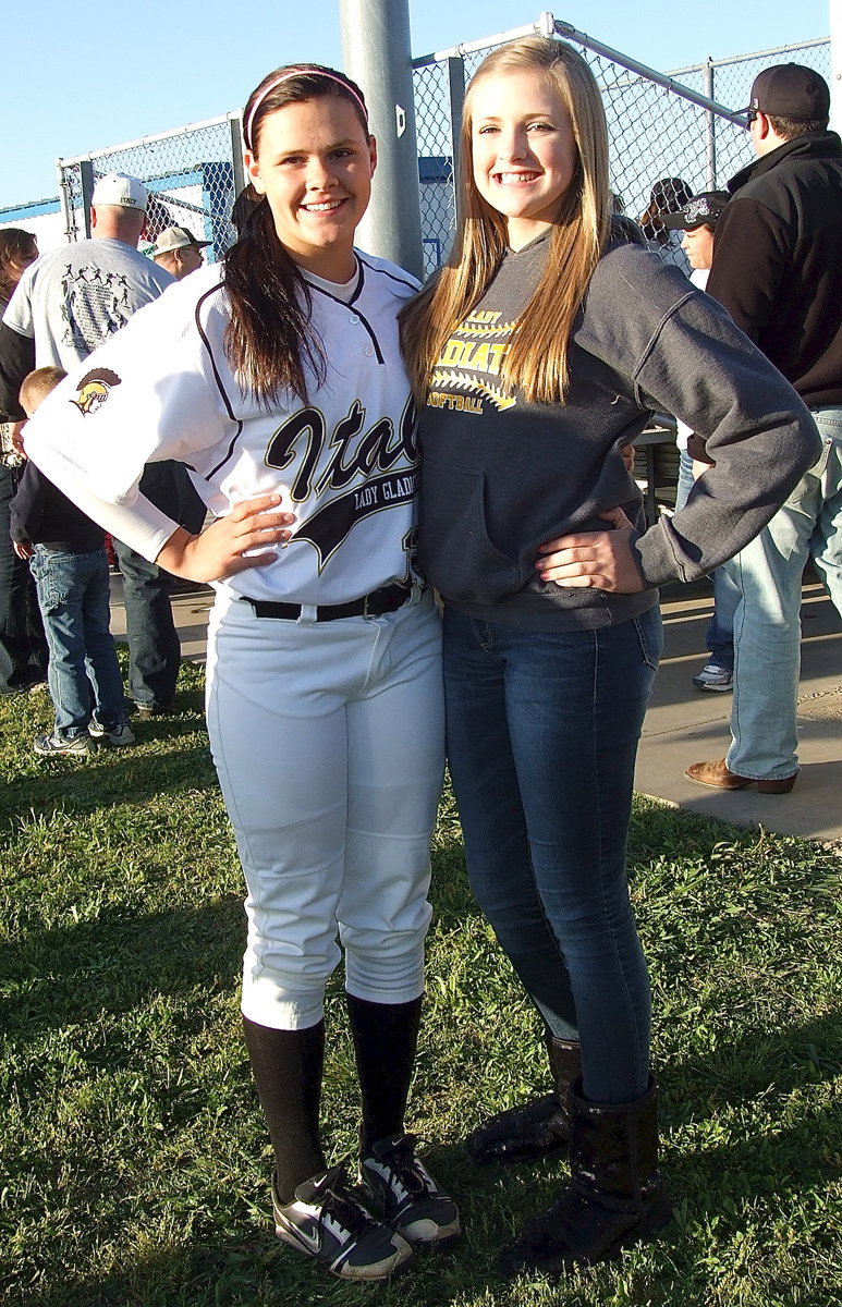 Image: Lillie Perry(12) poses with little sister Annie Perry between games.