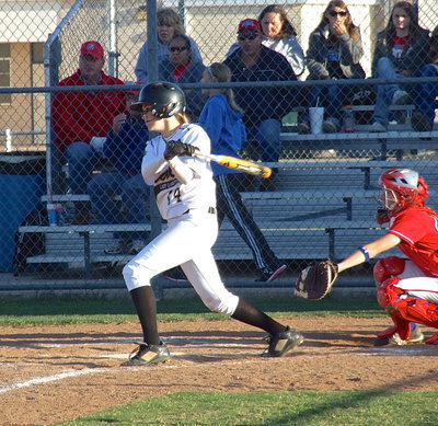 Image: A tremendous day for sophomore Kelsey Nelson(14) as she records another hit against Gorman.