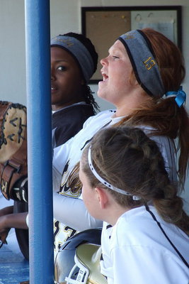 Image: Senior Katie Byers(13) helps lead the cheers from a lively Lady Gladiator dugout.