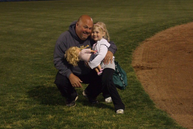 Image: Lady Gladiator head coach Wayne Rowe receives a congratulatory hug from daughter Hannah after Italy beat Gorman for the Area Championship.