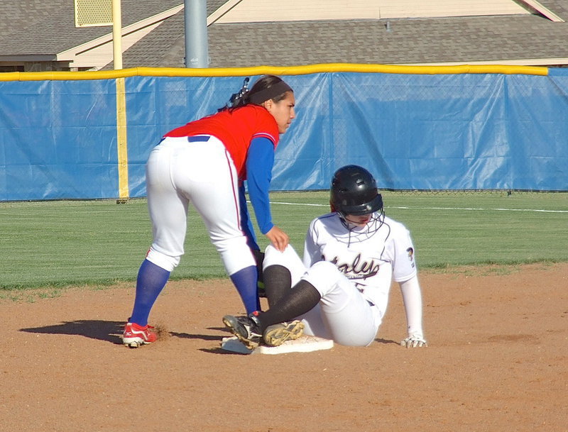 Image: Making it to second base is Italy’s Madison Washington(2).