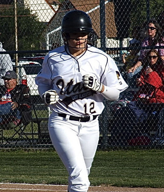 Image: Freshman Lillie Perry(12) moves the runners as a substitute hitter.