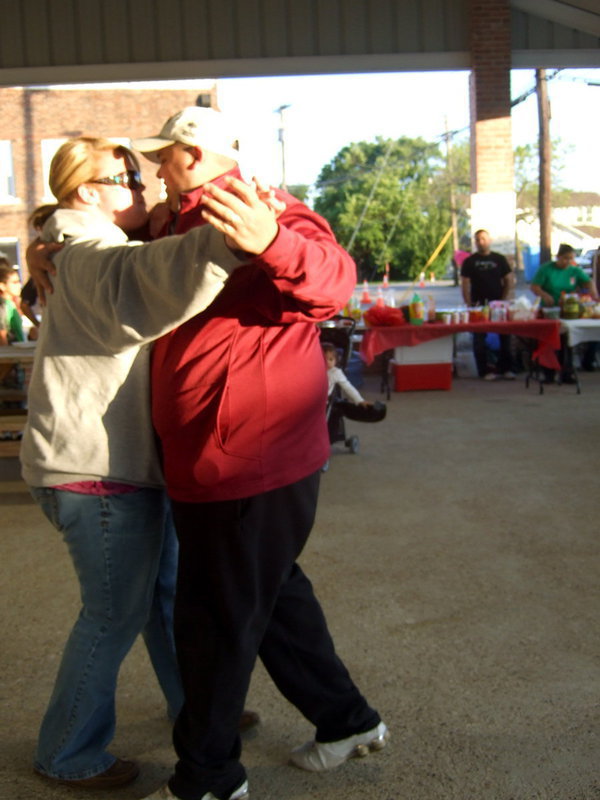 Image: A two stepping couple having lots of fun.