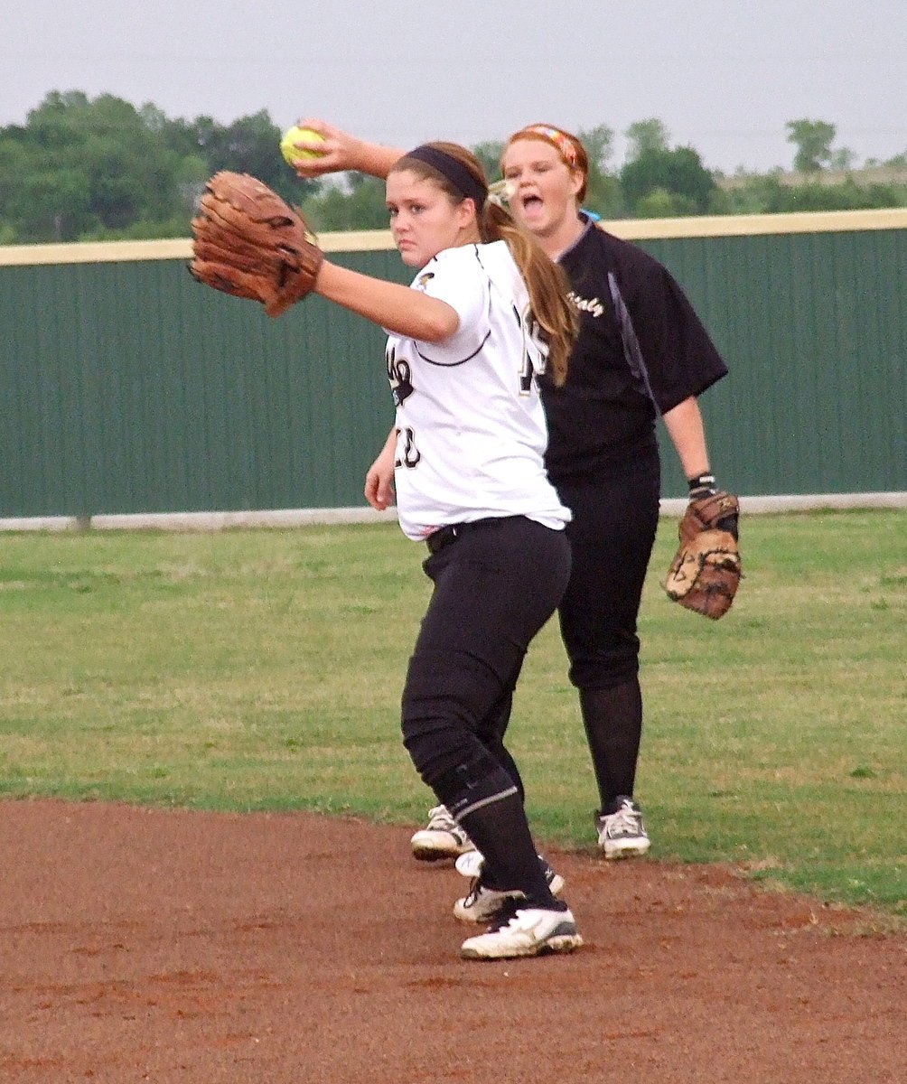 Image: Paige Westbrook(10) warms up while Katie Byers(13) makes some noise.