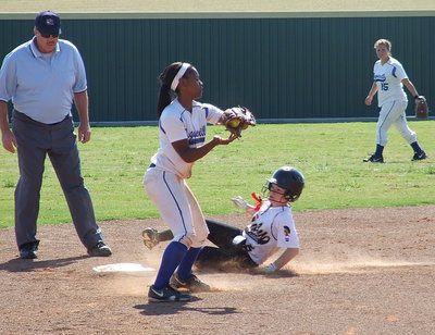 Image: Tara Wallis(5) slides safely into second base which was tough to do this weekend against Bosqueville.