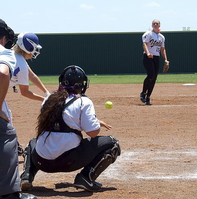 Image: Italy’s Jaclynn Lewis(15) goes after another Bosqueville batter with catcher Alyssa Richards(9) lending a hand.