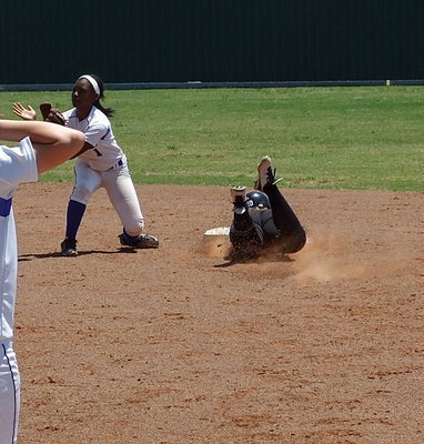 Image: Italy junior Paige Westbrook(10) slides head first into second base to beat the Bosqueville throw. Westbrook was slightly injured on the play but remained on the bag.