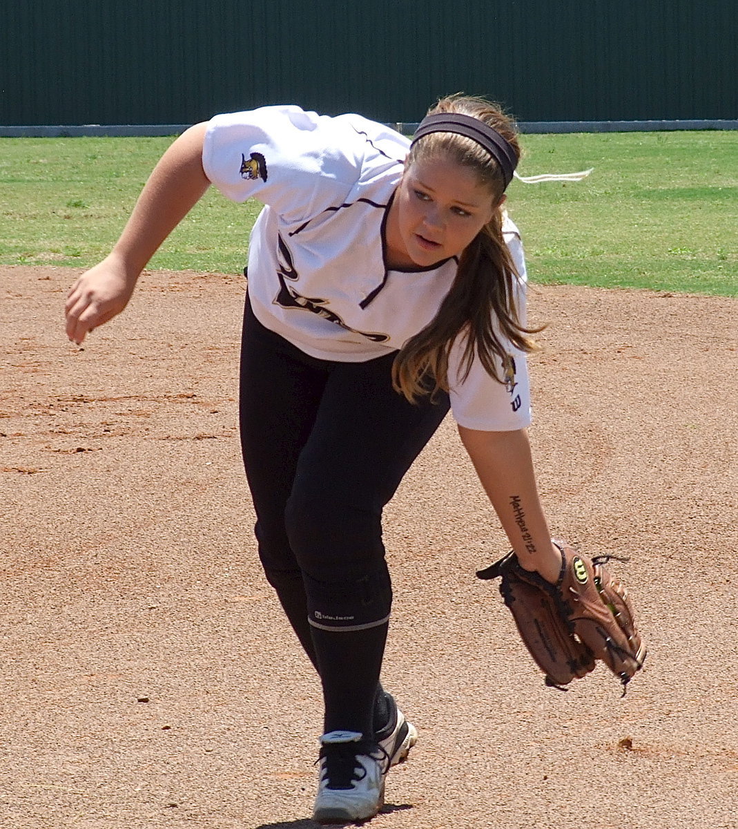 Image: Lady Gladiator junior Paige Westbrook(10) swoops in to catch a grounder as part of Italy’s warmup routine before challenging the Bosqueville Lady Bulldogs in the regional quarterfinals played in Hillsboro.