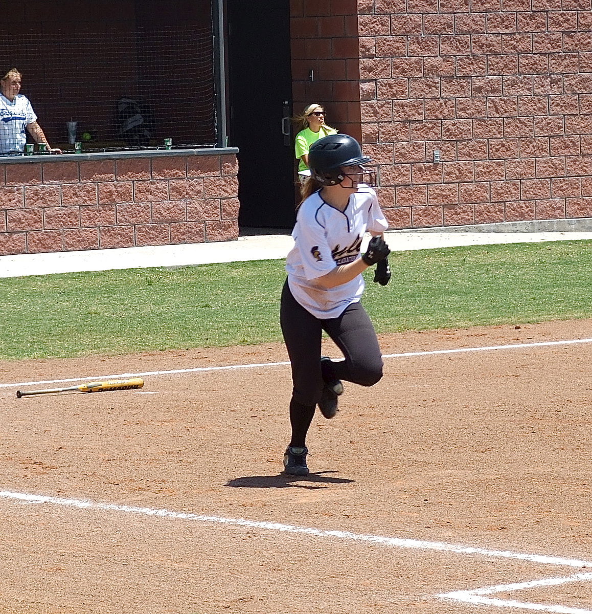 Image: Run, Kelsey, run! Italy’s Kelsey Nelson(14) hits the ball and rumbles to first base for Italy.