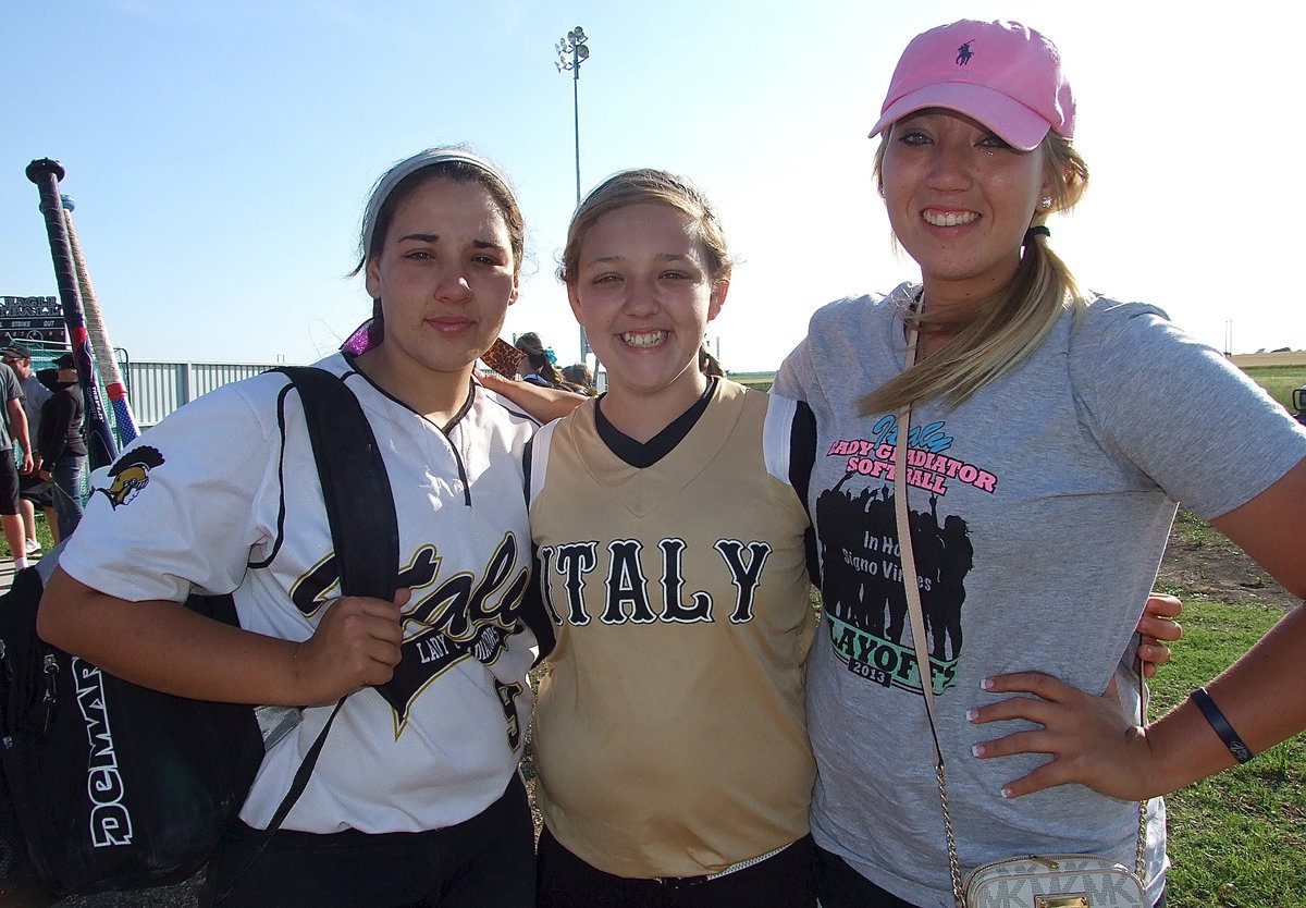 Image: Softball sisters: Following her final high school home game, Alyssa Richards(9) receives comfort from her siblings, little sister Brycelin Richards, and former teammate and big sister, Megan Richards.