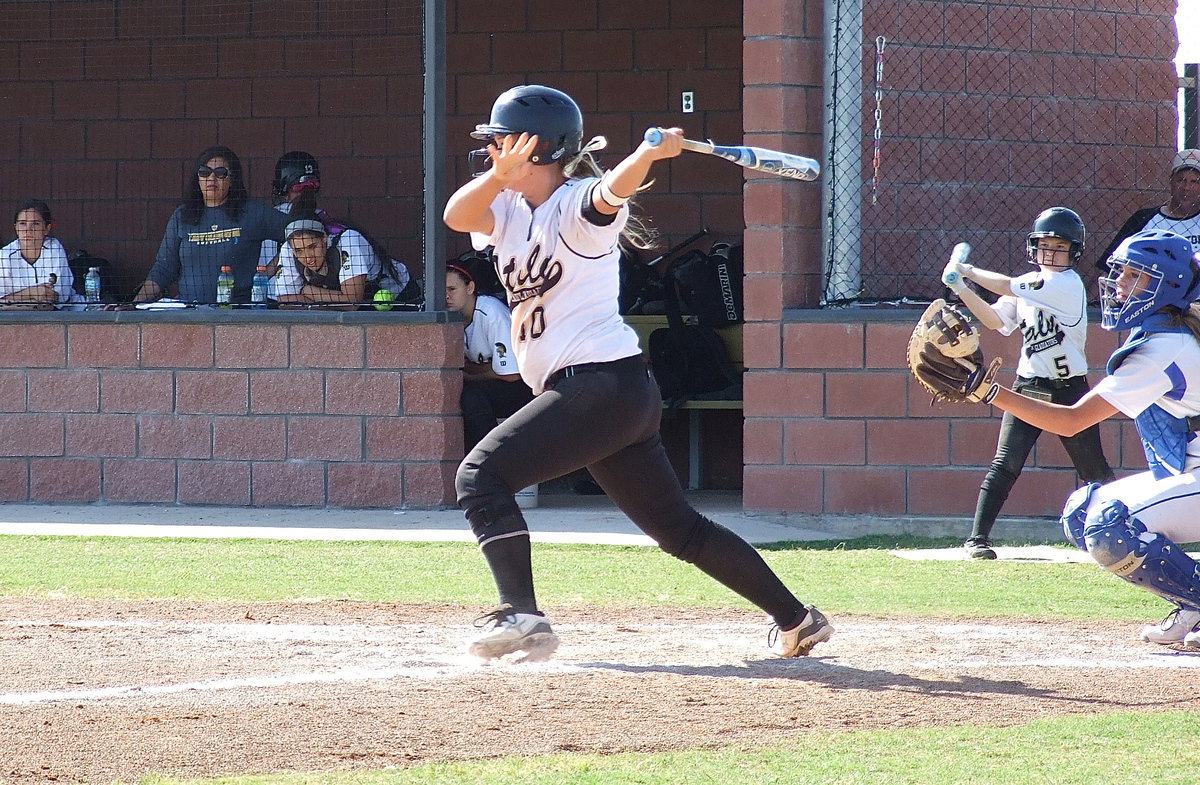 Image: One of Italy’s leading RBI hitters this season, Paige Westbrook(10), rips a hit toward Lady Bulldog defenders.