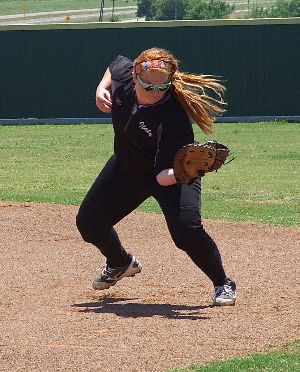 Image: Katie Byers(13) watches the ball all the way into her glove during warm-ups before Italy’s first game on Saturday against Bosqueville.