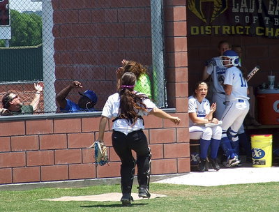 Image: Italy’s Alyssa Richards(9) tracks another foul ball near Bosqueville’s dugout.