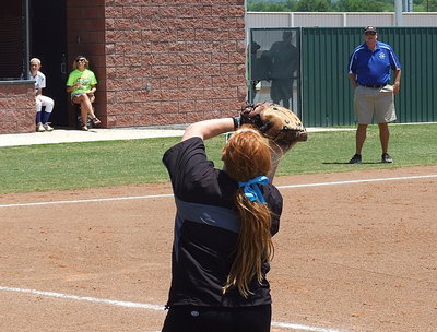 Image: Lady Gladiator first baseman Katie Byers(13) gets under a foul ball and gets the out for Italy.