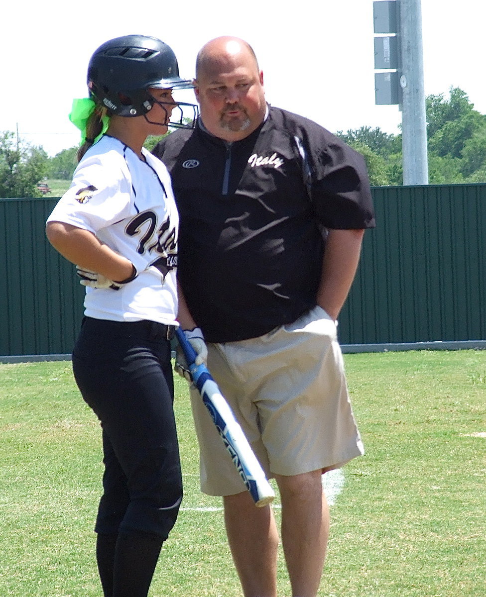 Image: Lady Gladiator head coach Wayne Rowe strategizes with Bailey Eubank(1).