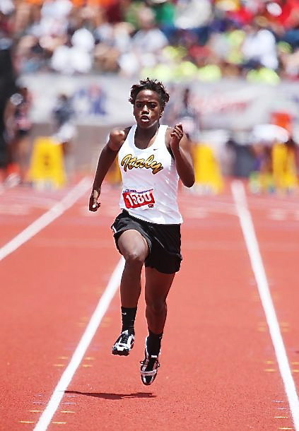 Image: Italy’s Kortnei Johnson, a sophomore, wins the girls 100 Meter Dash with a record breaking time of 11:52 to set new state record during the 2013 UIL 1A State Track Meet which was held at Mike A. Meyers Stadium on the University of Texas at Austin campus.