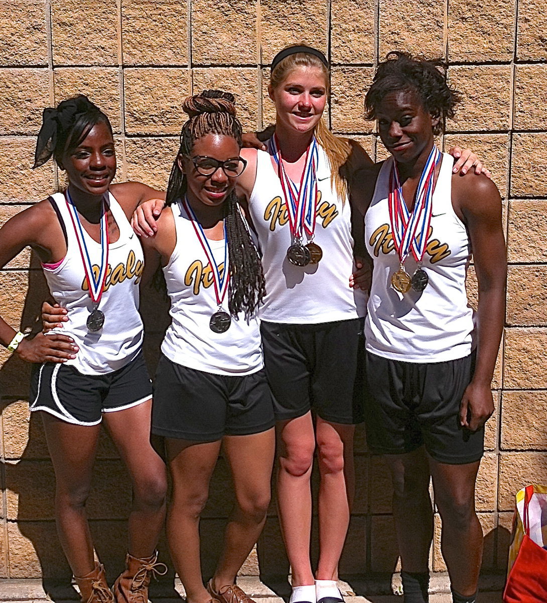 Image: Italy’s State qualifying 4×100 Meter Relay team members are Kendra Copeland, Ryisha Copeland, Halee Turner and Kortnei Johnson.