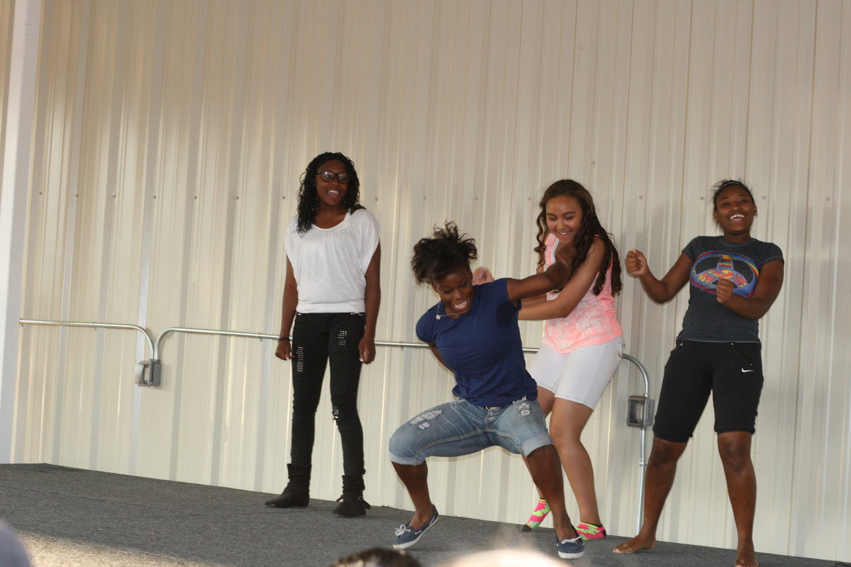 Image: Kortnei Johnson (10th), Vaness Cantu (8th), Moisha Walker (8th) and K’Breona Davis (10th) show the audience they can dance.