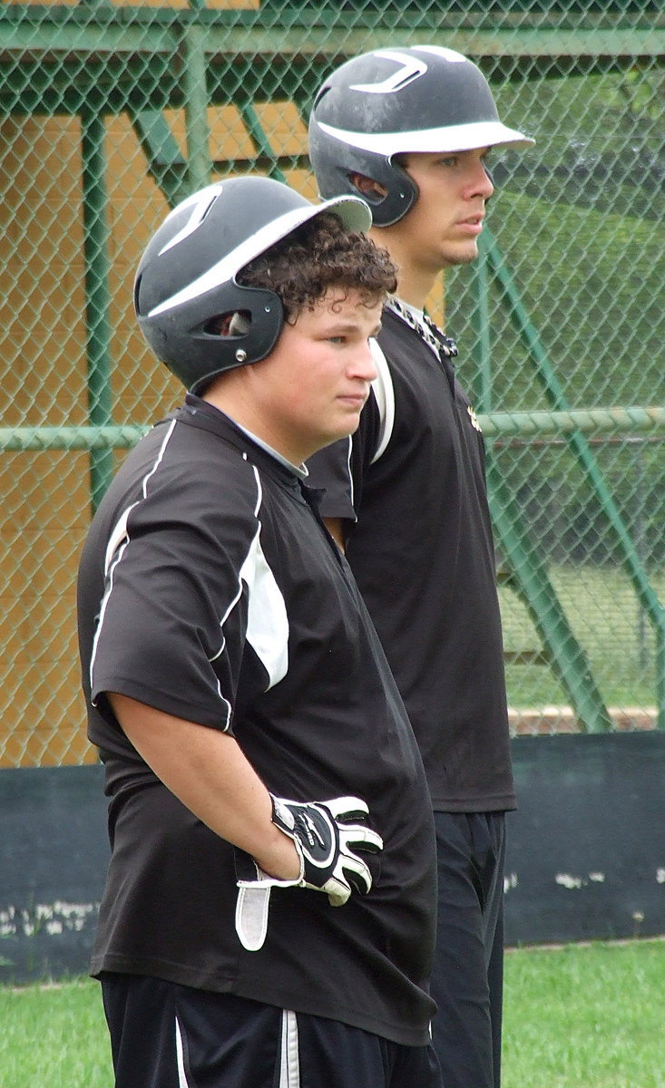 Image: John Byers and Cole Hopkins look on during batting practice.