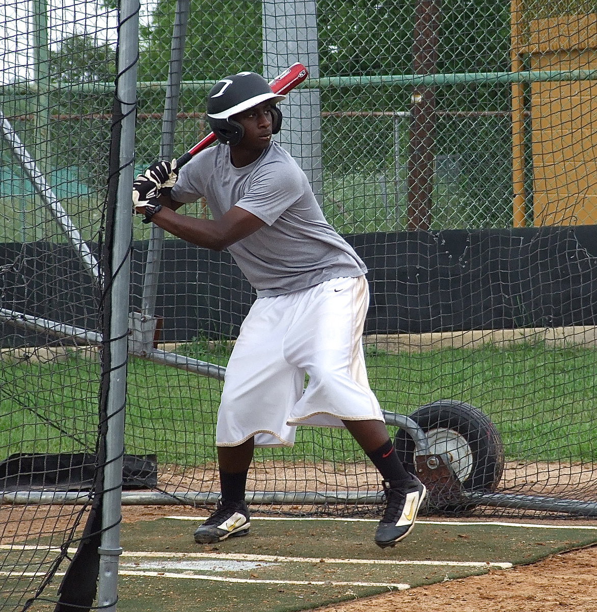 Image: Marvin Cox prepares to swing.