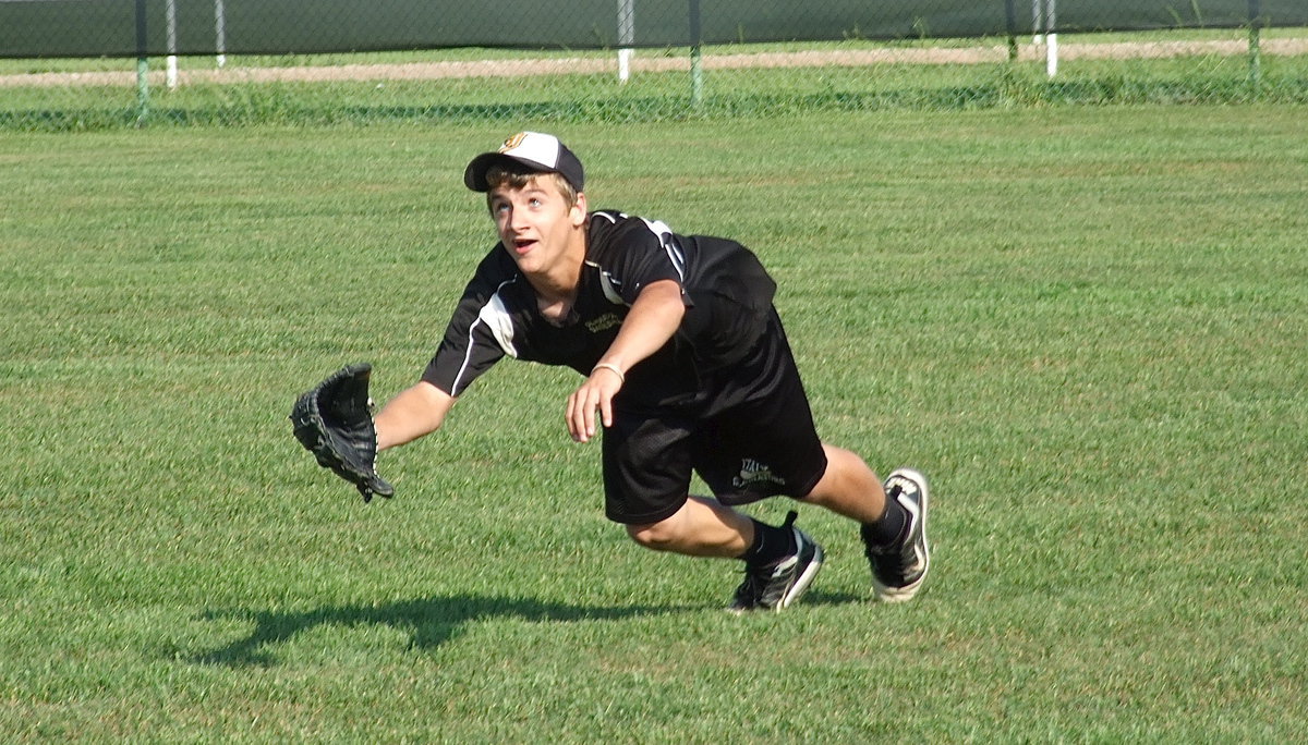 Image: Levi McBride dives for the ball.