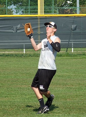 Image: Cody Boyd catches a fly ball in the outfield.