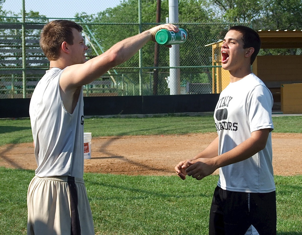 Image: Chase Hamilton helps his senior teammate Reid Jacinto out.