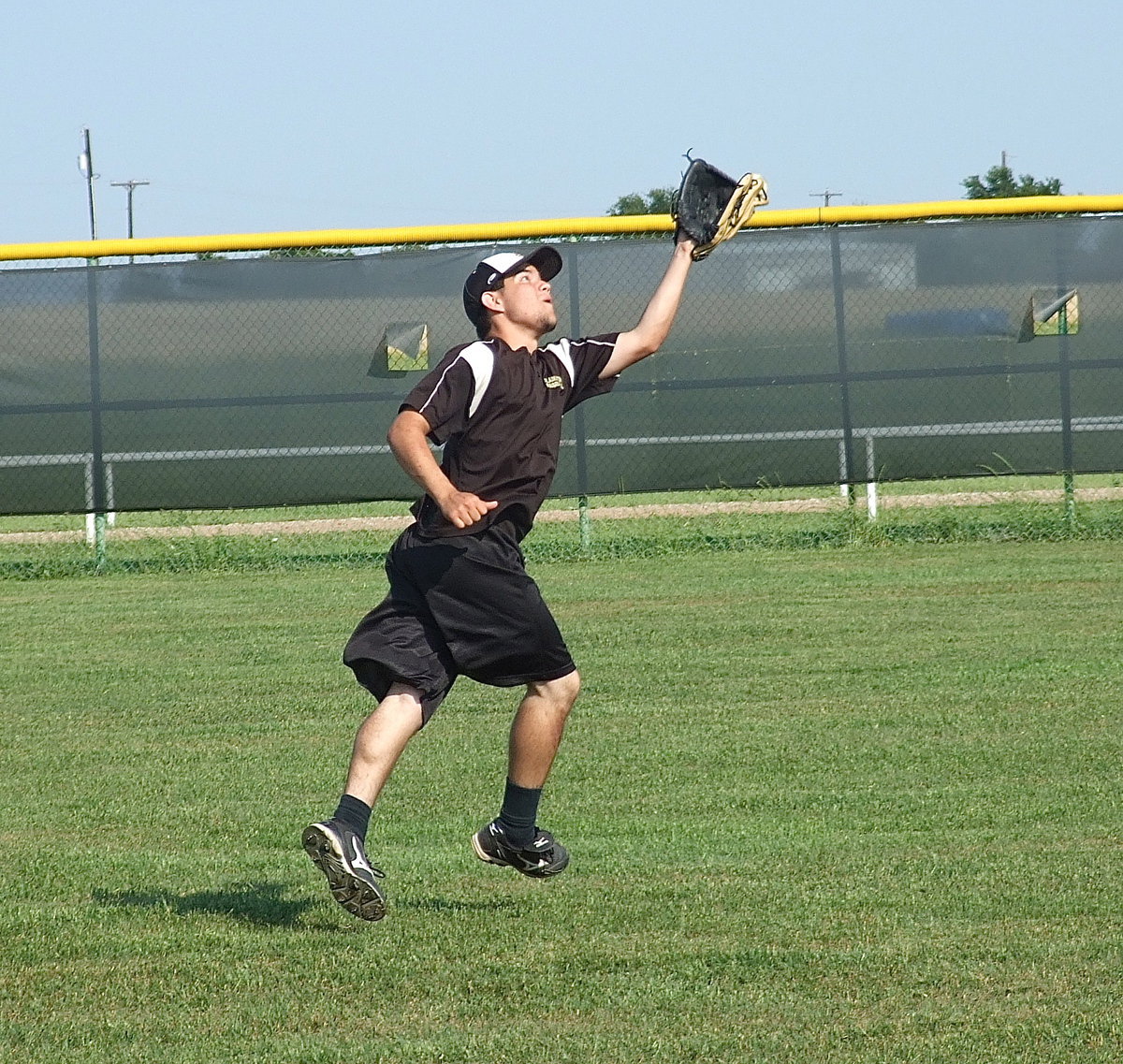 Image: Tyler Anderson goes after a fly ball.