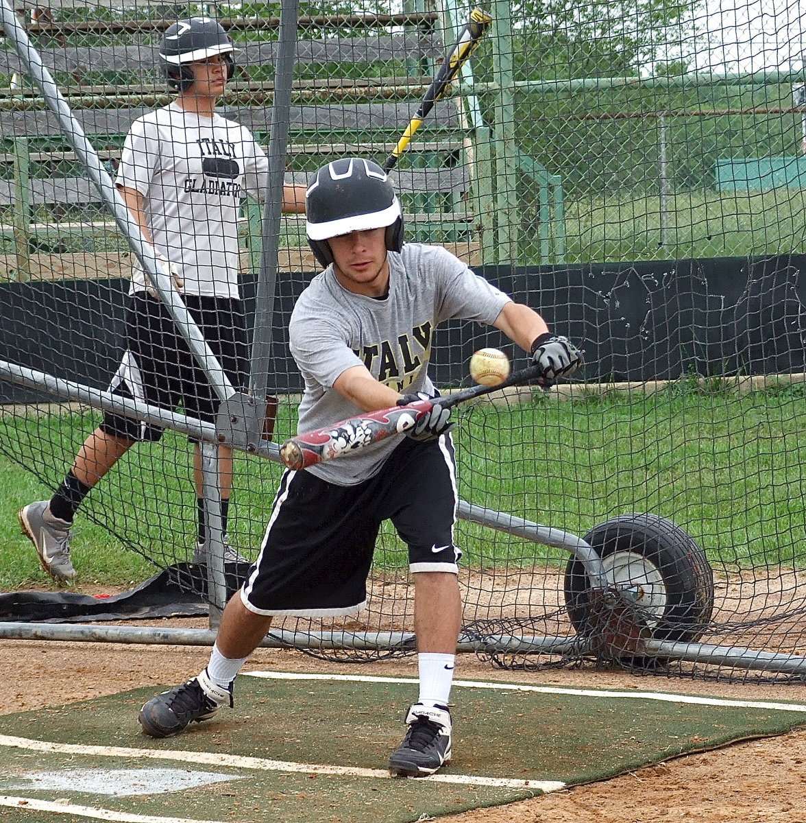 Image: Caden Jacinto practices bunting.