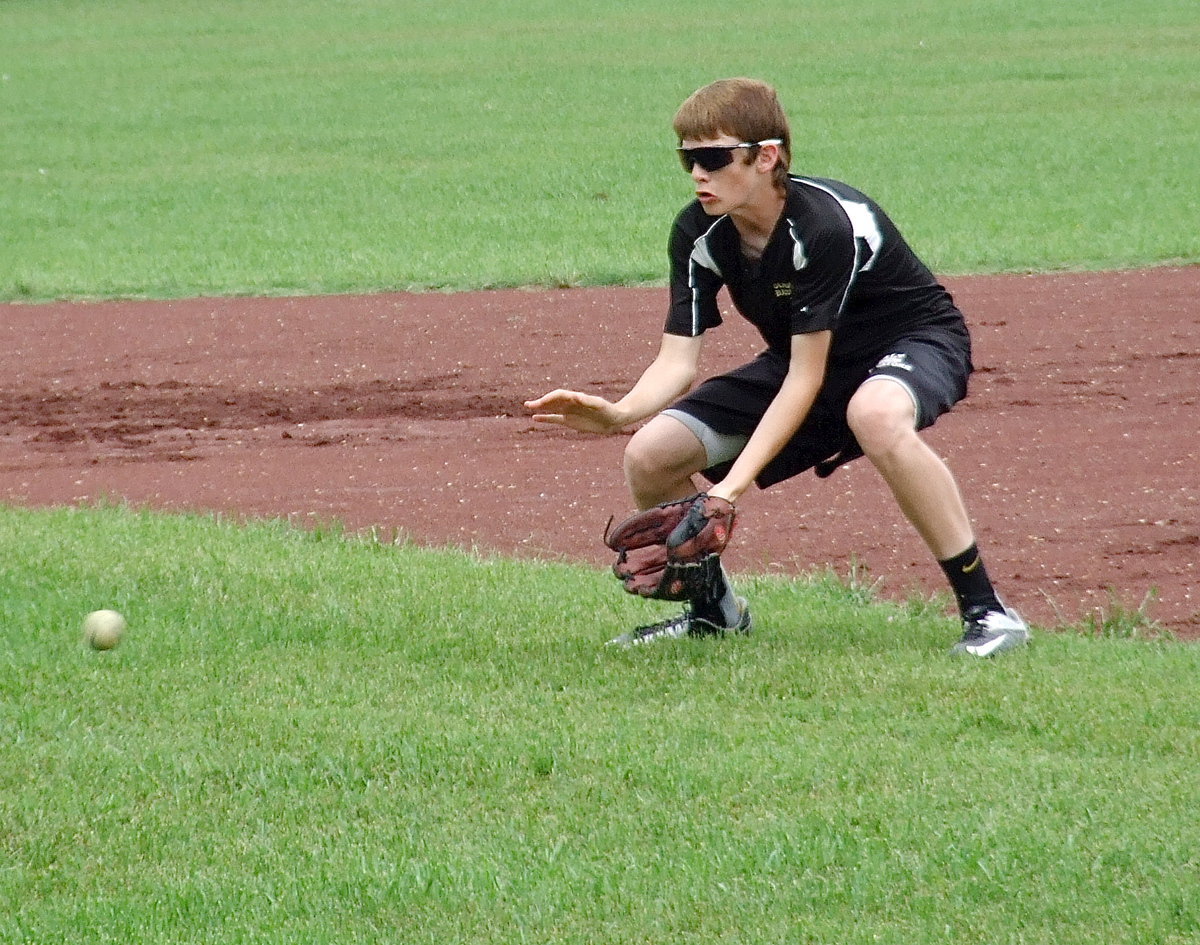 Image: Ty Windham drops down on a grounder.