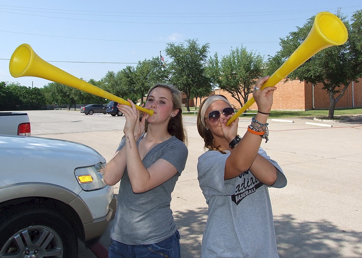 Image: Kelsey Nelson and Bailey Eubank make some noise for the Italy Baseball team as the Gladiators head to Forney for their regional quarterfinal matchup against Trenton.