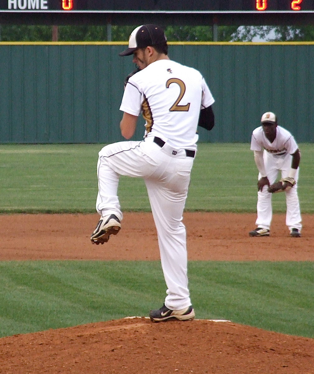 Image: Italy’s shortstop Marvin Cox(3) looks on as Caden Jacinto(2) leads the Gladiator charge from the mound.