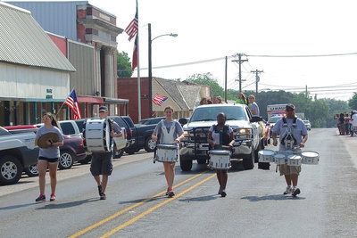 Image: Gladiator Regiment Marching Band members Reagan Adams, Gus Allen, Whitney Wolaver, Brenya Williams and band director Jesus Perez provide the, “Beat of Champions,” during the parade.