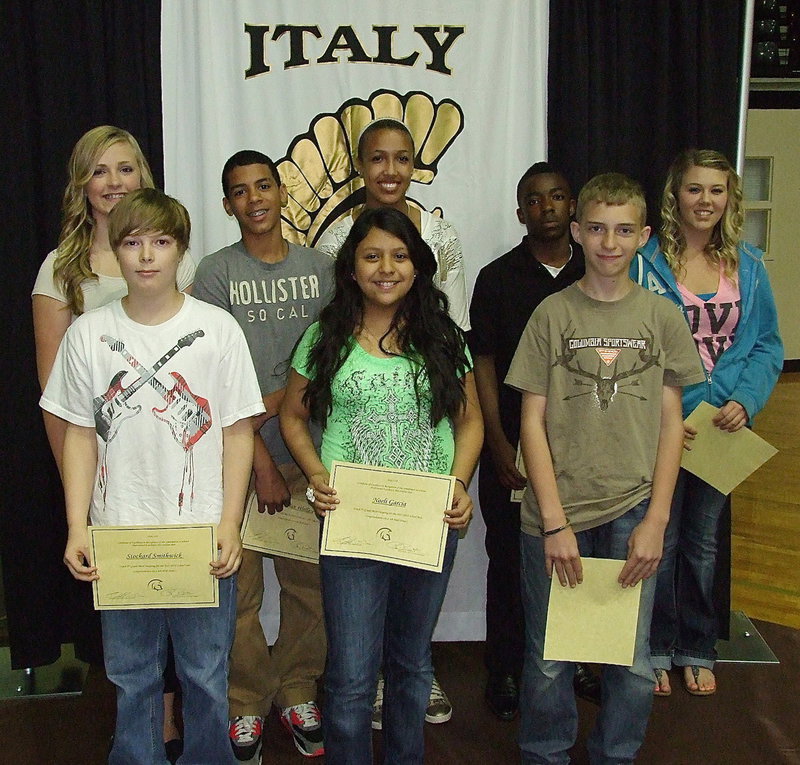 Image: 7th graders Annie Perry, Stockard Smithwick, Tylan Wallace, Noeli Garcia, Emmy Cunningham, Kendrick Norwood, Colton Allen and Sydney Meeks are presented awards during the 2013 Italy Junior High Awards Ceremony held inside Italy Coliseum.