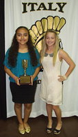 Image: 2011-2012 Oliphant Cup Trophy recipient, Britney Chambers, presents the 2012-2013 Oliphant Cup Trophy to Vanessa Cantu.