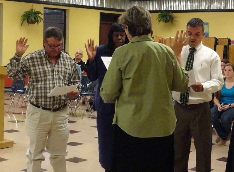 Image: Natasha Blackburn swears in new school board members — Larry Eubank, Ida Overton and Sal Ramirez