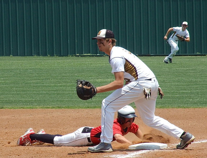 Image: Gladiator first baseman Cole Hopkins(9), a senior, holds a runner at first base as, right fielder, Hayden Woods(8) backs up the throw.