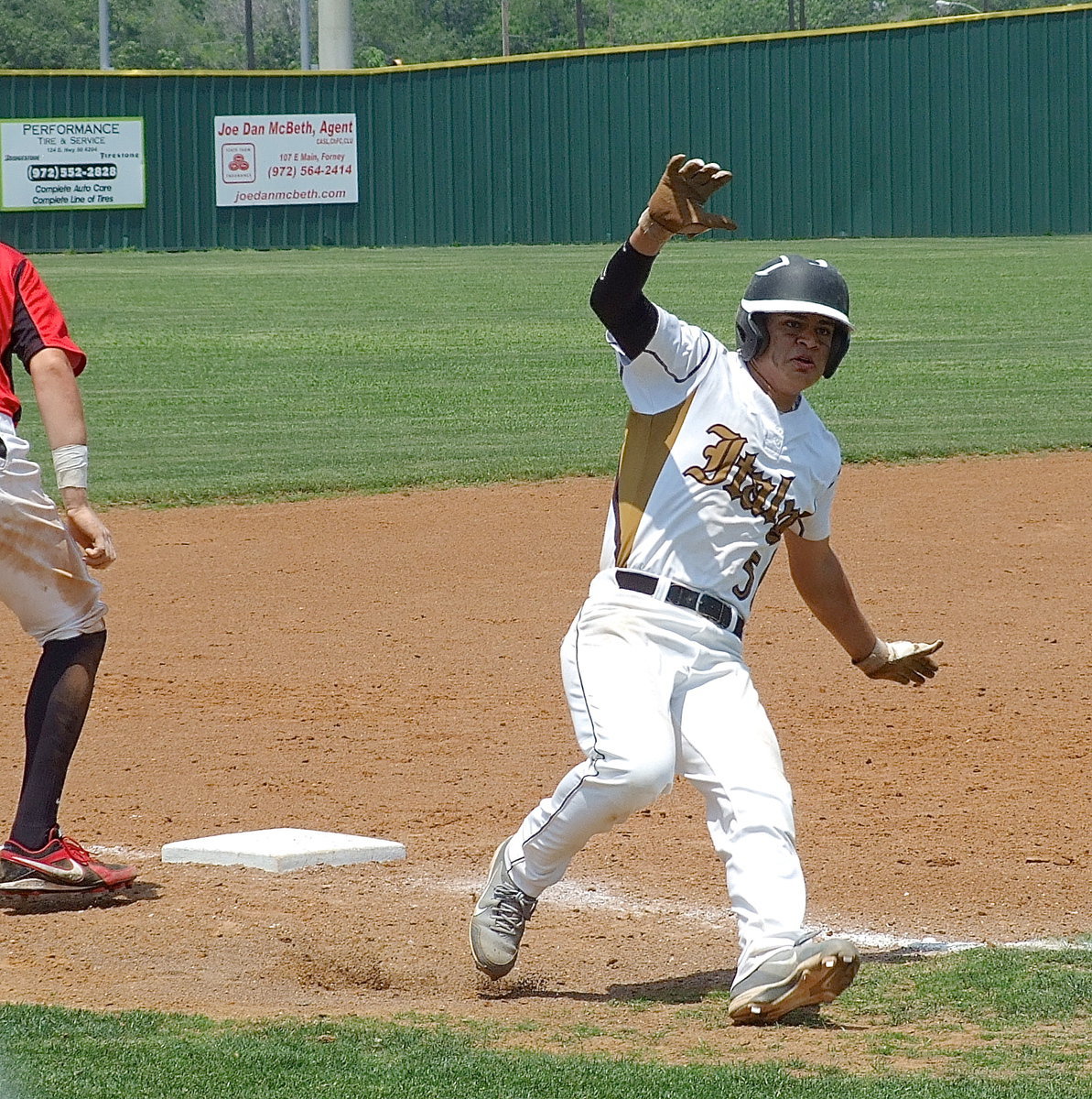 Image: Reid Jacinto(5) rounds third base to head home but puts on the breaks when the coaches yell for him to hold at third.