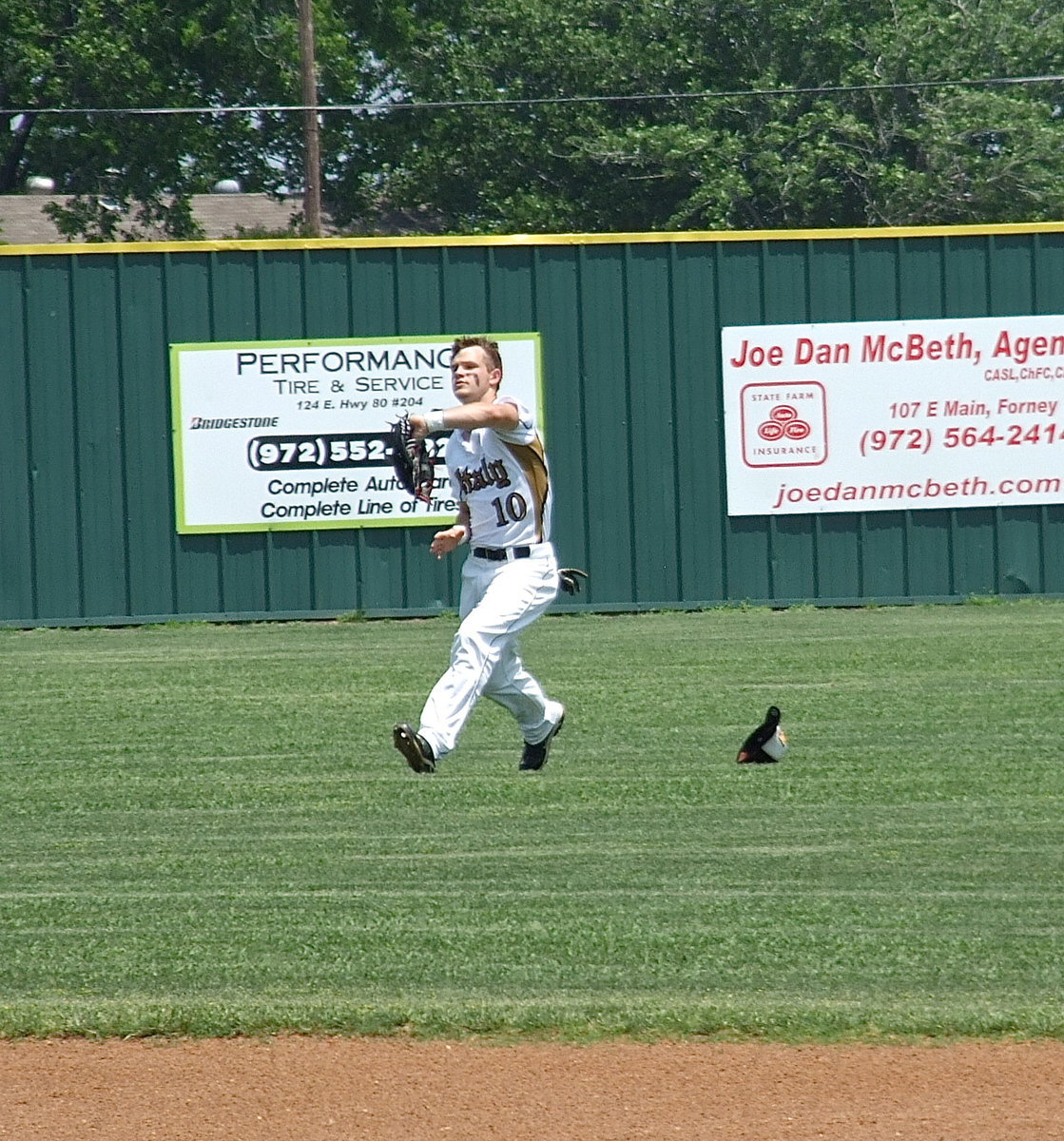 Image: Italy senior center fielder, Chase Hamilton(10) tracks down a pop fly.