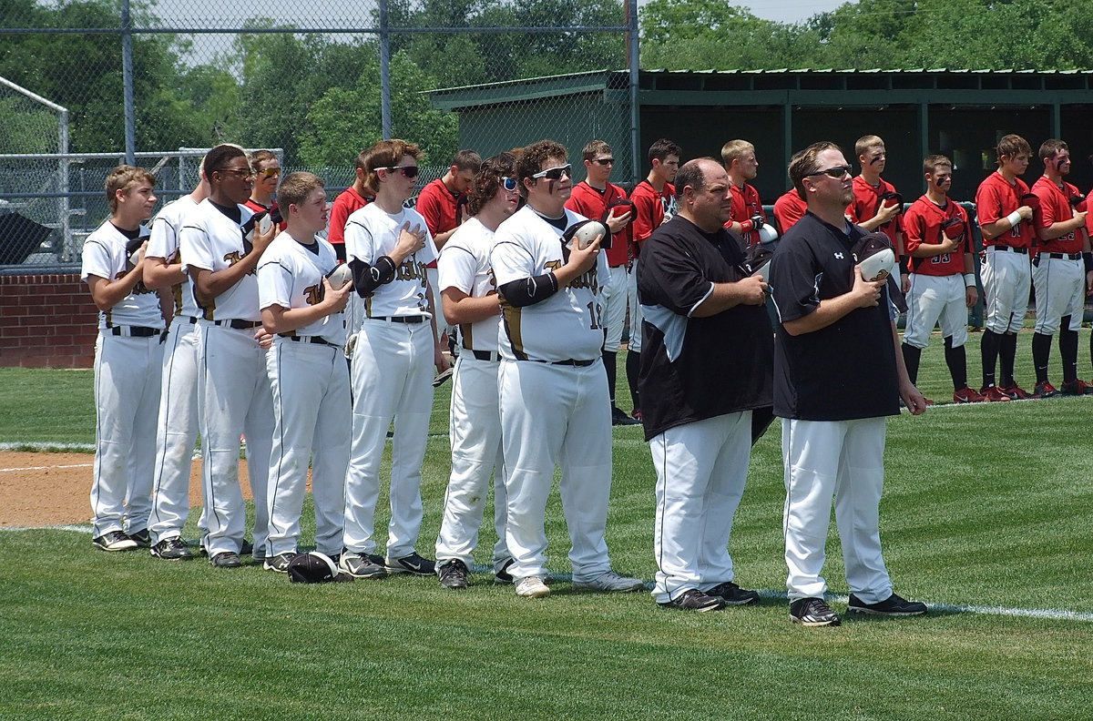 Image: Italy players paying tribute are Levi McBride, Cody Boyd, John Hughes, John Escamilla, Ty Windham, Kyle Fortenberry, John Byers, assistant coach Brian Coffman and head coach Josh Ward.