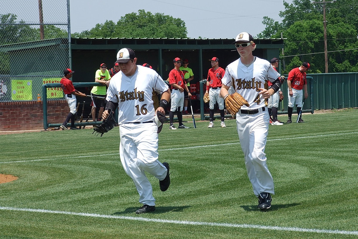 Image: Kevin Roldan(16) and Cody Boyd(4) hustle in after pre-game warmups before the start of Italy’s regional quarterfinal matchup against Trenton.