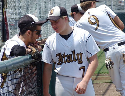 Image: Senior, Caden Jacinto(2), chats with sophomore, John Escamilla(7), while senior, Cole Hopkins(9), talks with freshman, Ty Windham(12), before the game as the elders pass on the torch.