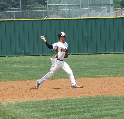 Image: Second baseman Reid Jacinto(5) throws to first base for an out.