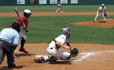 Image: Freshman catcher Ryan Connor(17) reacts to an outside pitch.