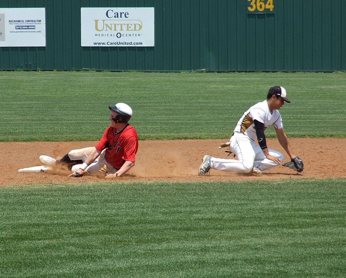 Image: Trenton steals second base while Italy’s Reid Jacinto(5) keeps the ball from going into the outfield.