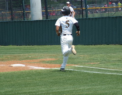 Image: Reaching first base is Reid Jacinto(5) who was a bright spot for Italy’s offense against Trenton.