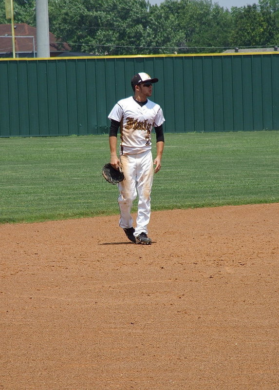 Image: Caden Jacinto(2) ponders his final moments as an Italy Baseball player while covered with the stains of being in battle.