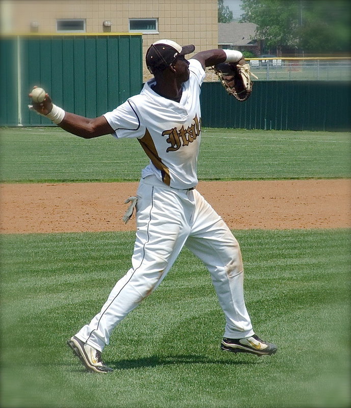 Image: Marvin Cox(3) stays active at third base.