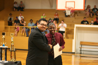 Image: Mr. Perez offers congratulations to 7th Grader, Anthony Lusk.